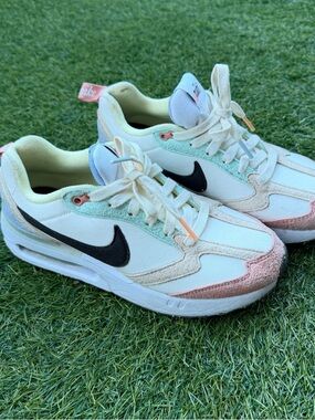Nike White Sneakers with Black Swoosh and Mint & Pink Accents